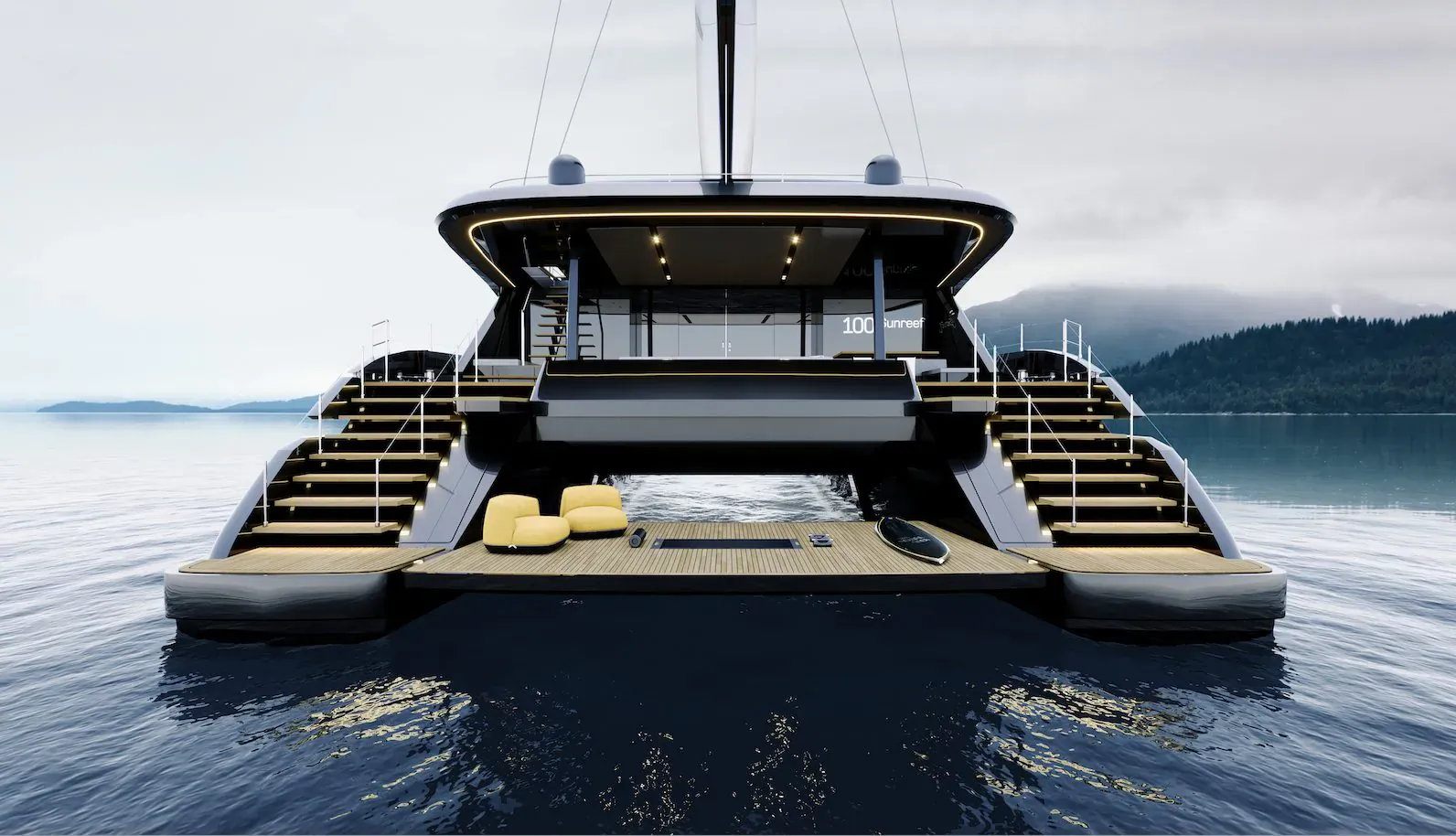 Rear view of Sunreef 100 ECO luxury catamaran with yellow loungers and stairs, docked on calm water amid mountains.