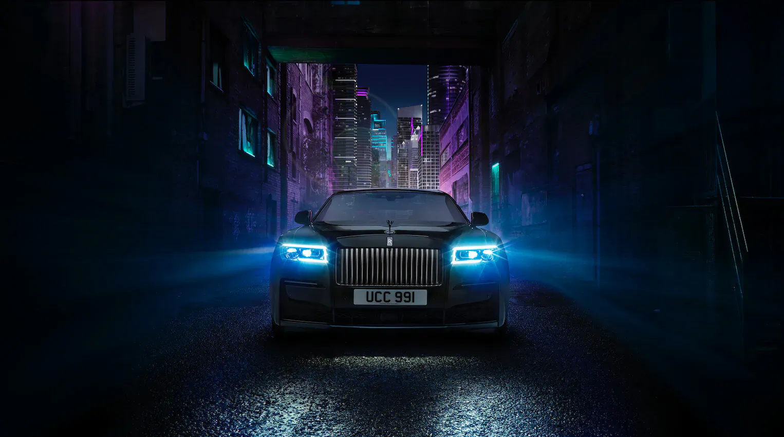 Black Badge Rolls-Royce Ghost with glowing blue headlights parked in neon-lit cyberpunk alley, license plate JCK 39.