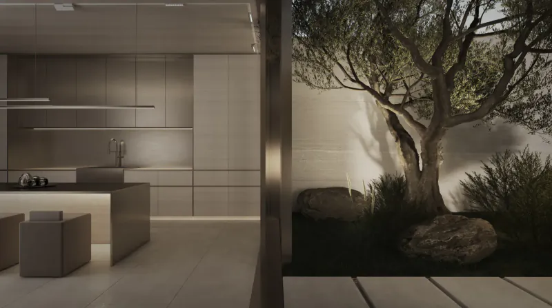 Modern minimalist kitchen with neutral tones opening to serene outdoor olive tree and rock garden