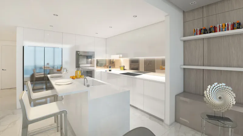 Modern white kitchen in luxury condo with ocean view, island, bar stools, and decorative shelves.
