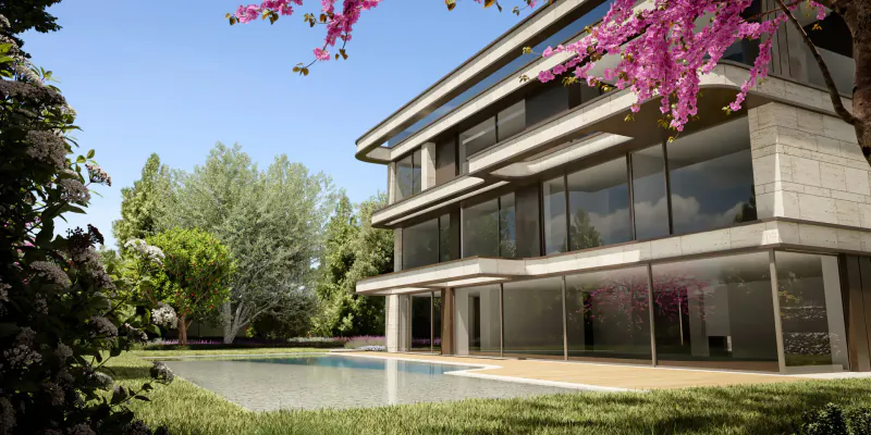 Modern three-story ultra-luxury villa in Barcelona with large glass windows, pink cherry blossoms, pool, and lush garden.
