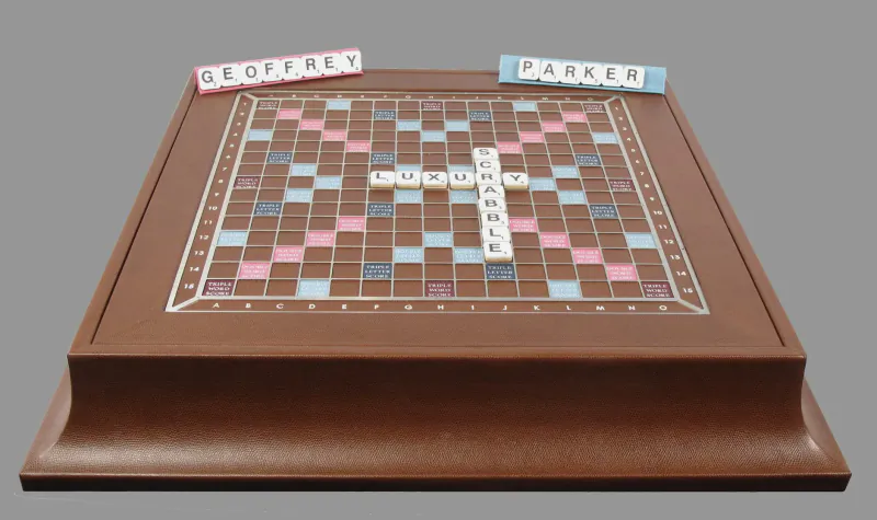 Luxury wooden Scrabble board game with tiles spelling 'Geoffrey Parker', Geoffrey and Parker player racks.