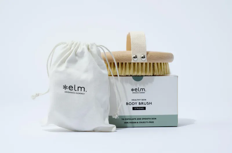 Elm Organics body brush in white box with drawstring pouch, sustainable luxury amenity