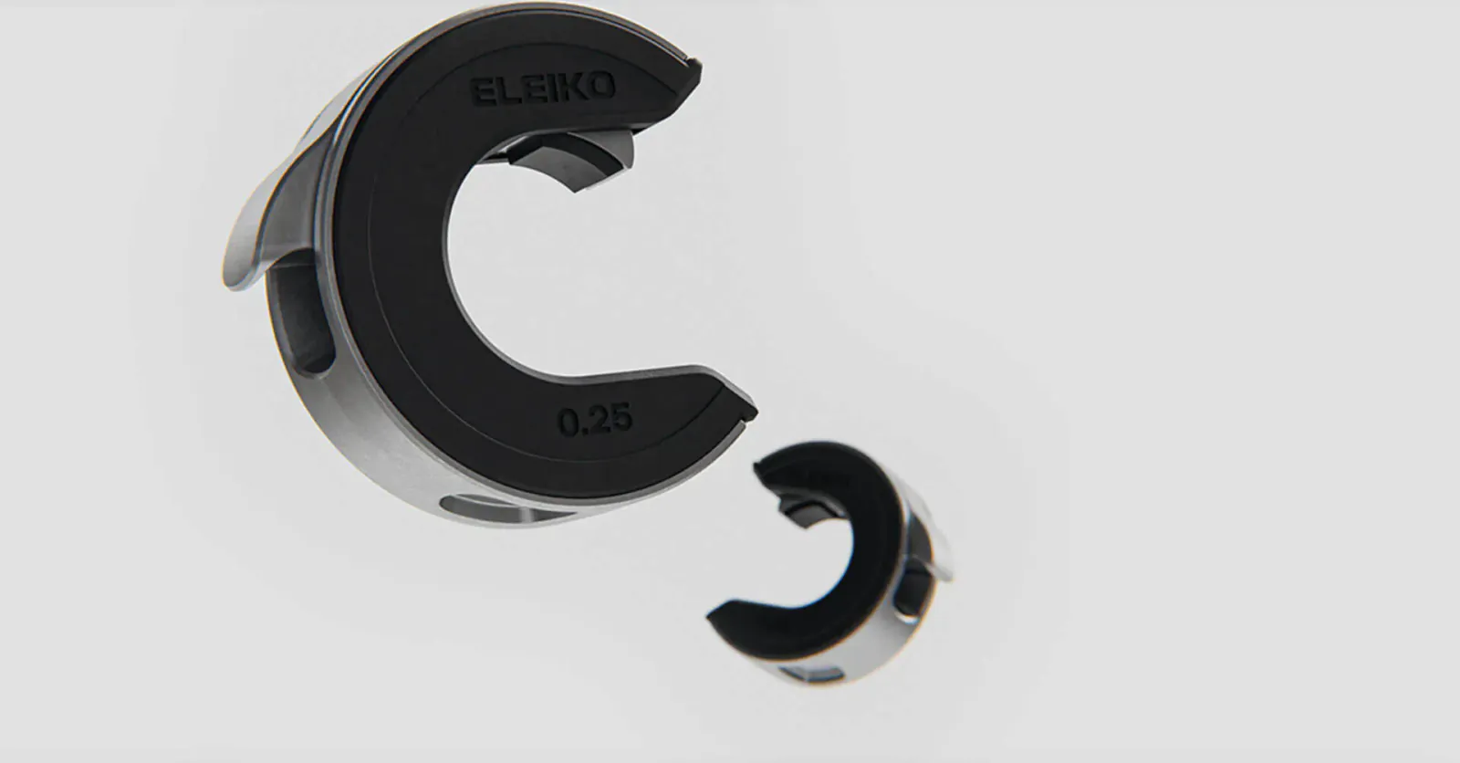 Eleiko Öppen Collars in black and silver, model ÖP3, C-shaped design, Red Dot Award 2021 winner, floating view.