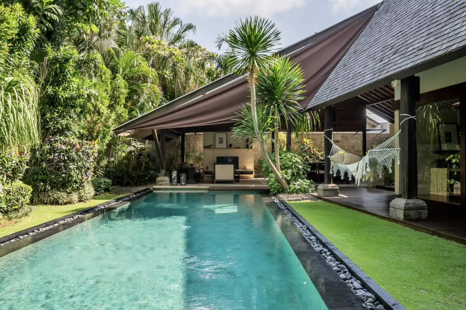 Ametis Villa Bali: tropical infinity pool, lush gardens, hammock, modern open pavilion under shady palms