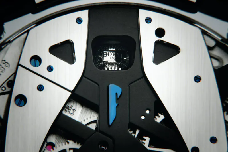Close-up of BOVET Battista Tourbillon watch movement with blue P logo and intricate gears