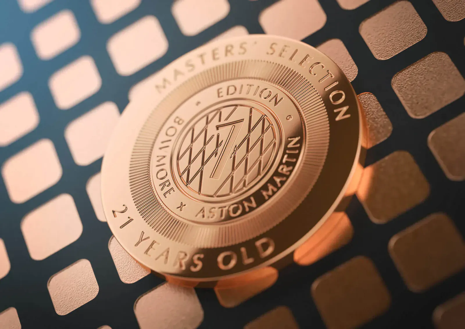 Bowmore Masters' Edition 21 Years Old whisky coin with Aston Martin logo on copper-toned grid background