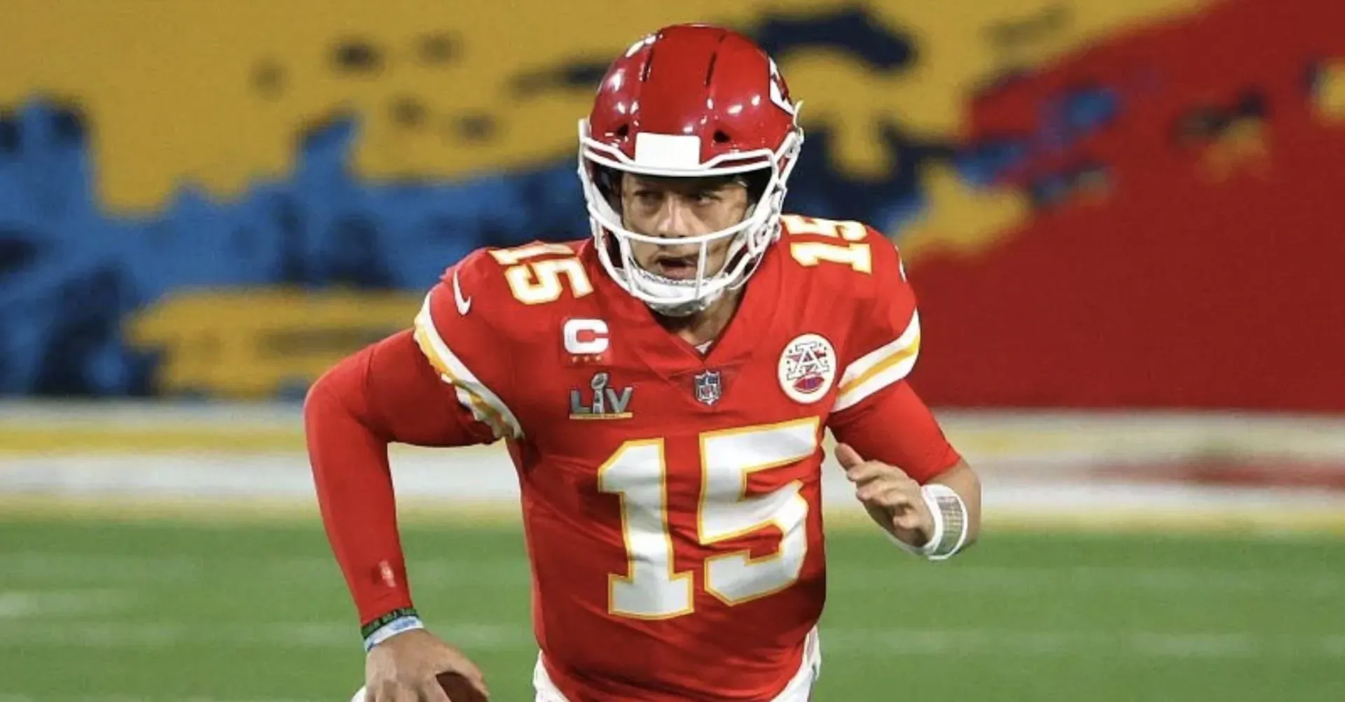 Patrick Mahomes #15 in red Kansas City Chiefs Super Bowl jersey and helmet, running on field