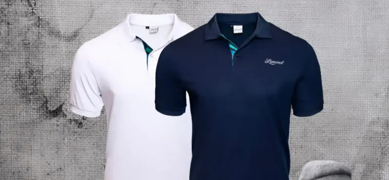 White and navy 'Gallery' golf polo shirts with teal collar accents on gray background
