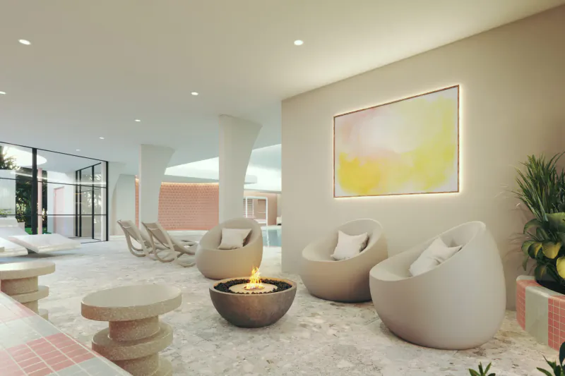 Luxury St Moritz Hotel lounge with beige pod chairs, lit fire pit, pool view, plants, and abstract art.