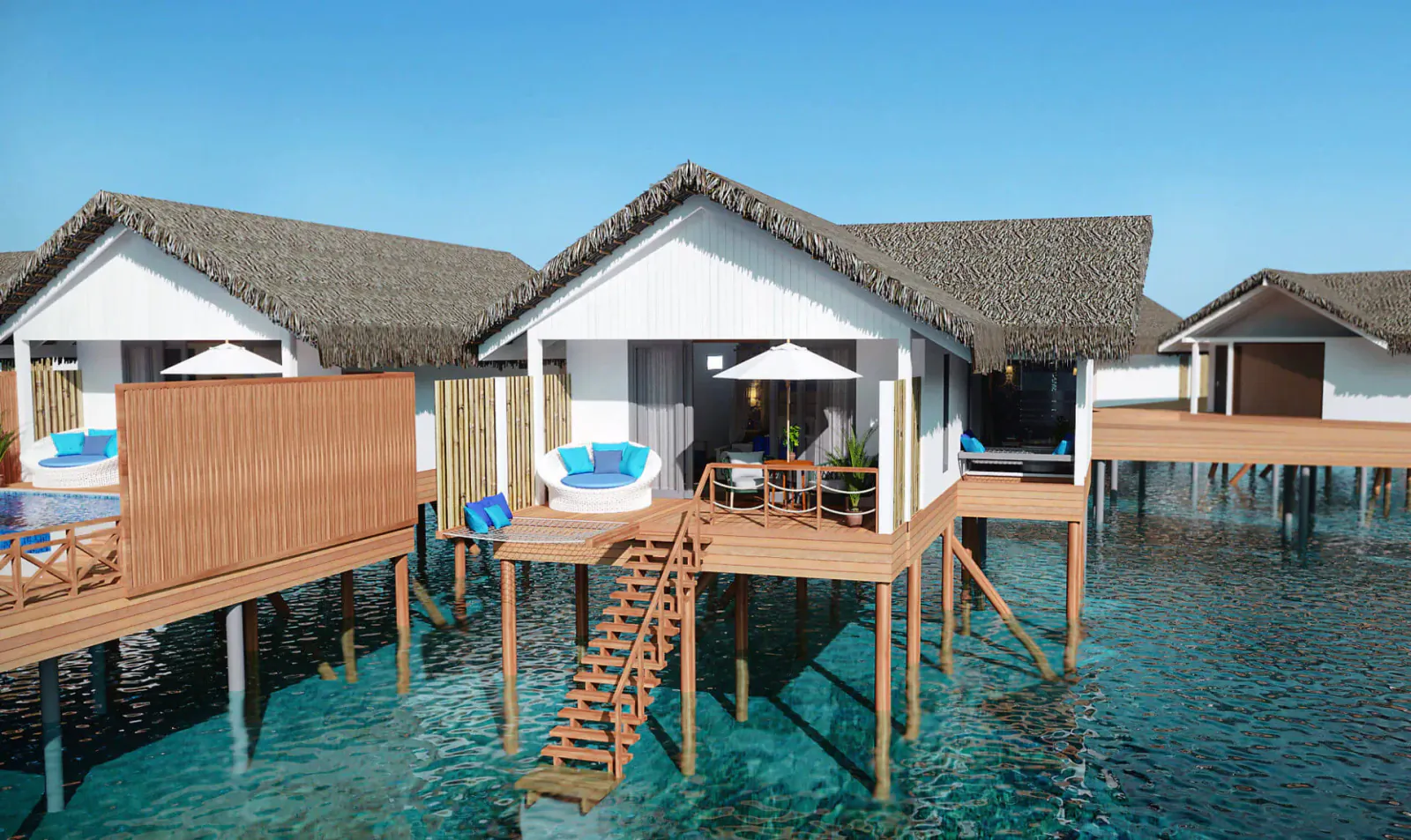 Luxury overwater villas at Cora Cora Maldives with thatched roofs, blue loungers, umbrellas on wooden decks over turquoise lagoon