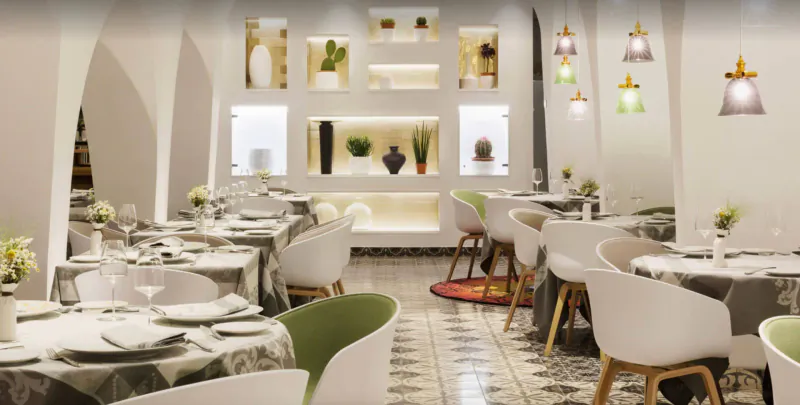 Elegant dining room at Grand Hotel Portals Nous by Marcel Wanders, with white arched walls, plants, pendant lights, and round tables.
