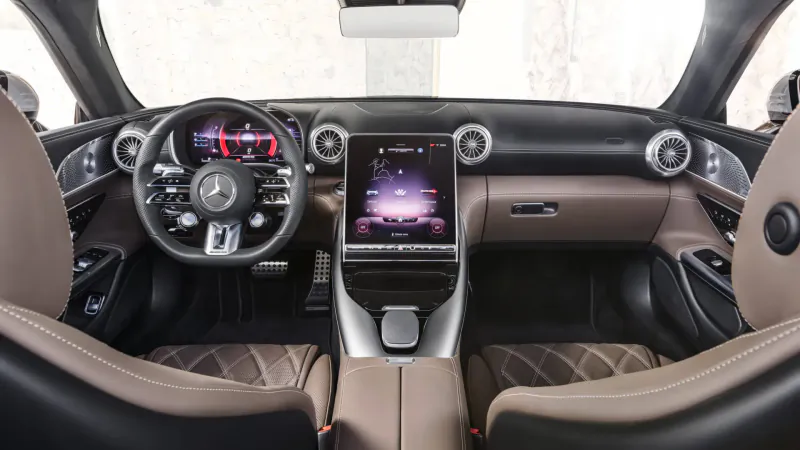 Mercedes-AMG SL interior dashboard with large MBUX touchscreen, leather seats, and sport steering wheel