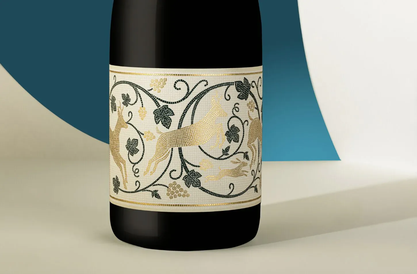 Luxury black sparkling wine bottle with gold foil label of leaping deer and vines, on blue backdrop