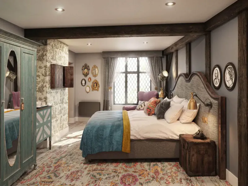 Elegant Hotel Indigo bedroom in Stratford-upon-Avon with exposed beams, teal bed, ornate headboard, and vintage decor.