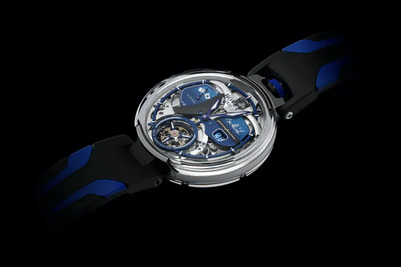 BOVET Battista Tourbillon luxury watch with blue accents, skeletonized dial, and black rubber strap on black background
