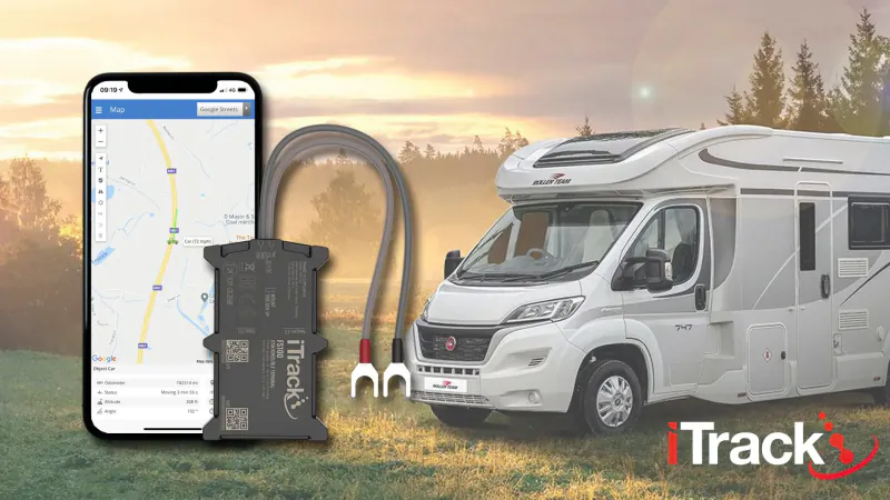 iTrack3 GPS tracker device with hoses attached to white campervan, iPhone showing map, sunset campsite, iTrack3 logo.