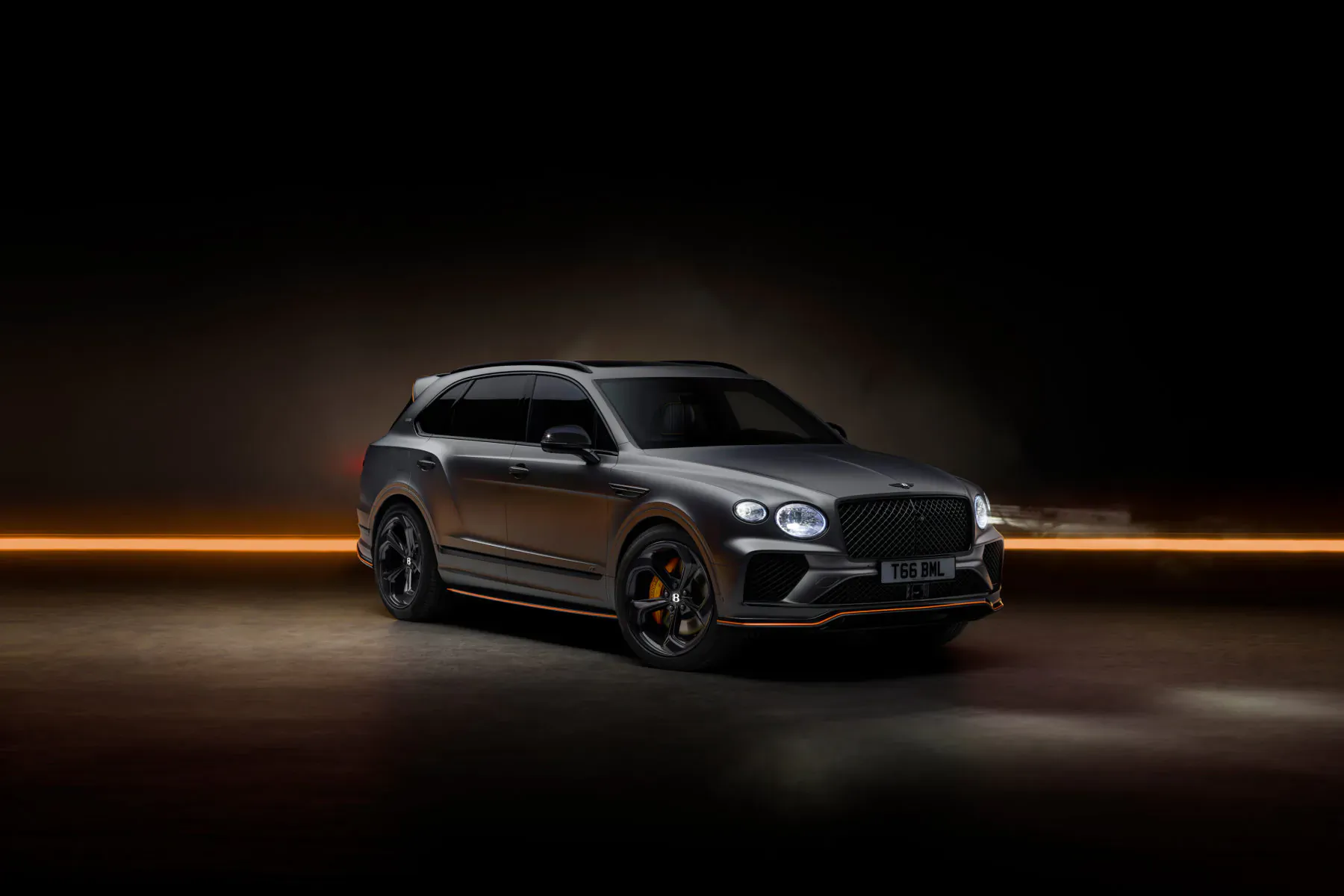 Black Bentley Bentayga Wings Identifies Black Edition SUV with orange accents on dark studio background
