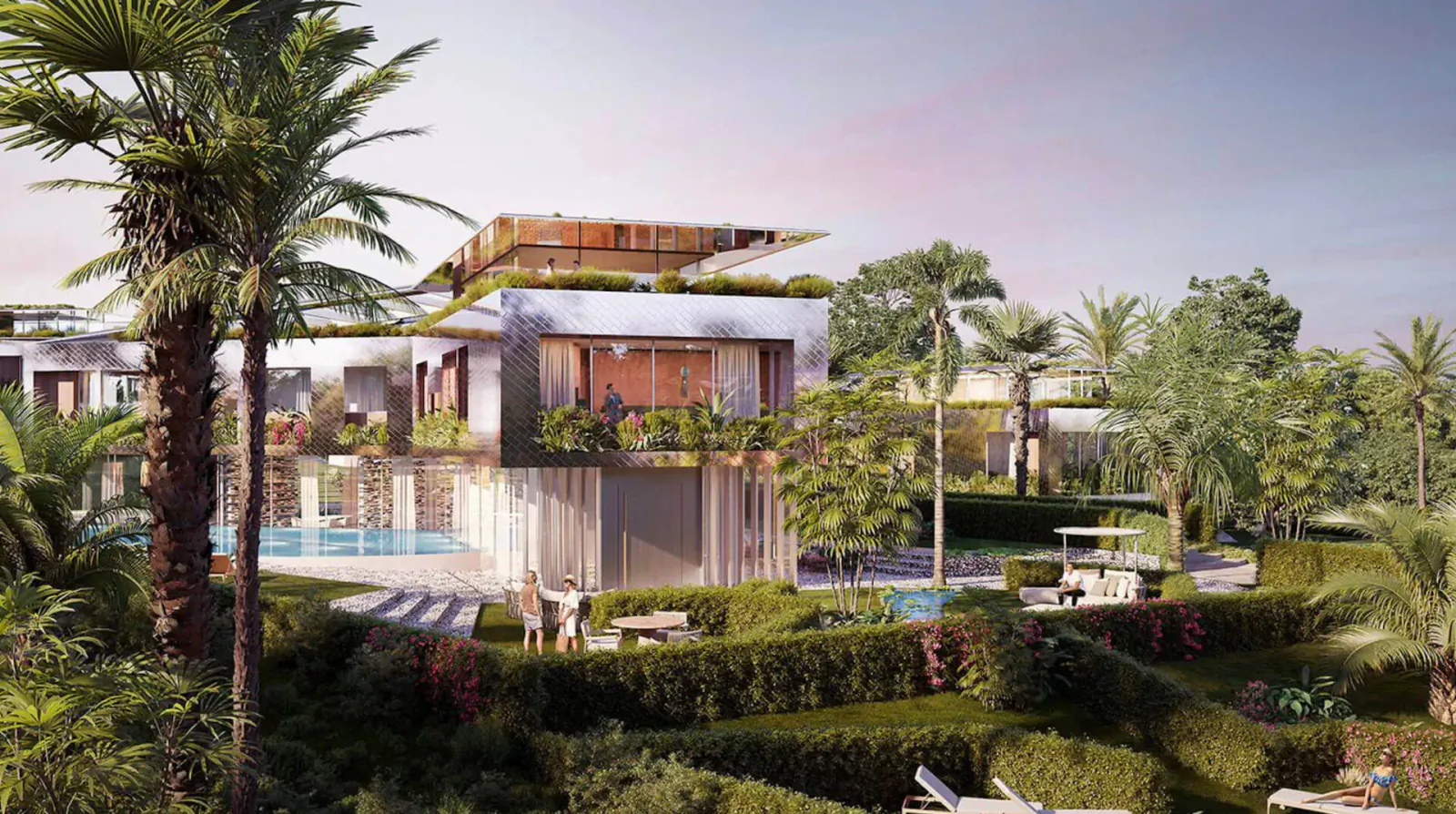 Modern Karl Lagerfeld Villas Marbella luxury homes with orange roofs, infinity pools, palms, and lush gardens at sunset.