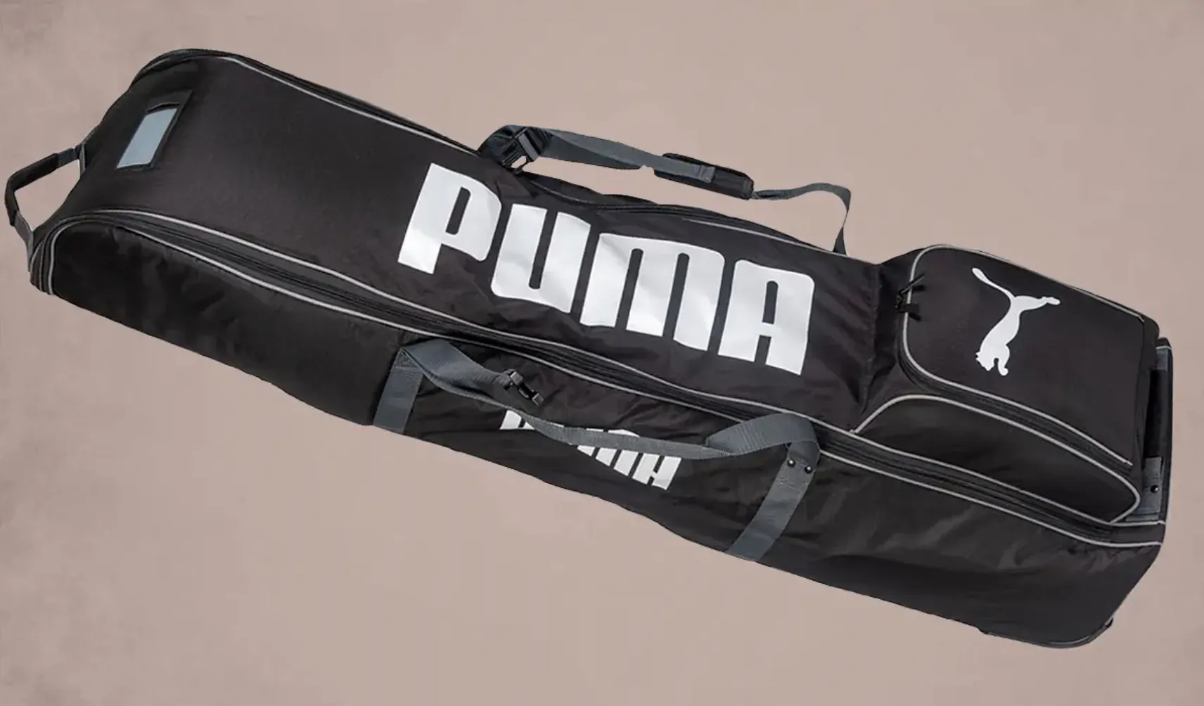 Black Puma wheeled golf travel bag with white Puma logo and puma emblem, angled view.