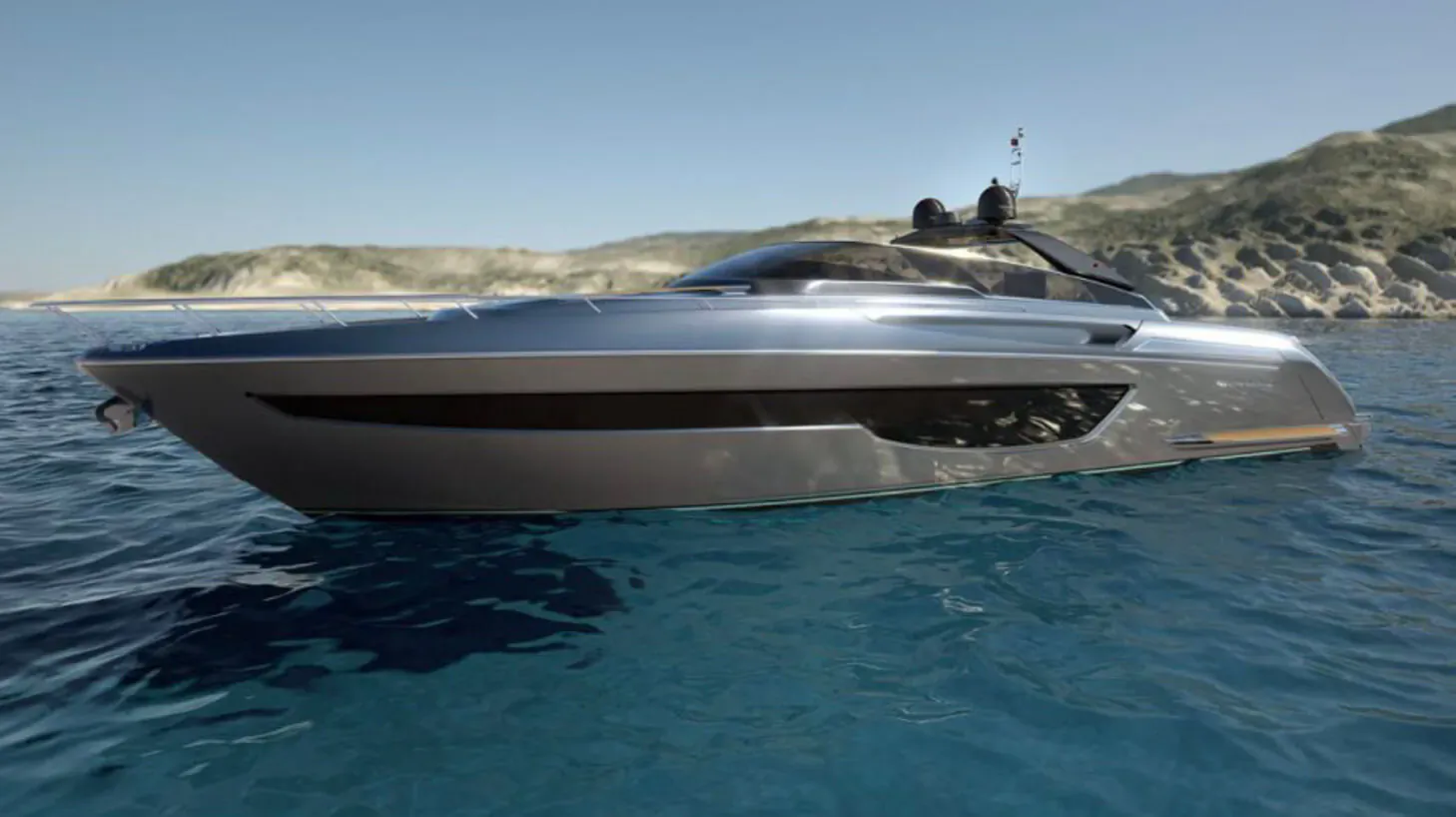 New 76-foot silver Bahamas Super yacht by Riva on blue sea with rocky hills backdrop