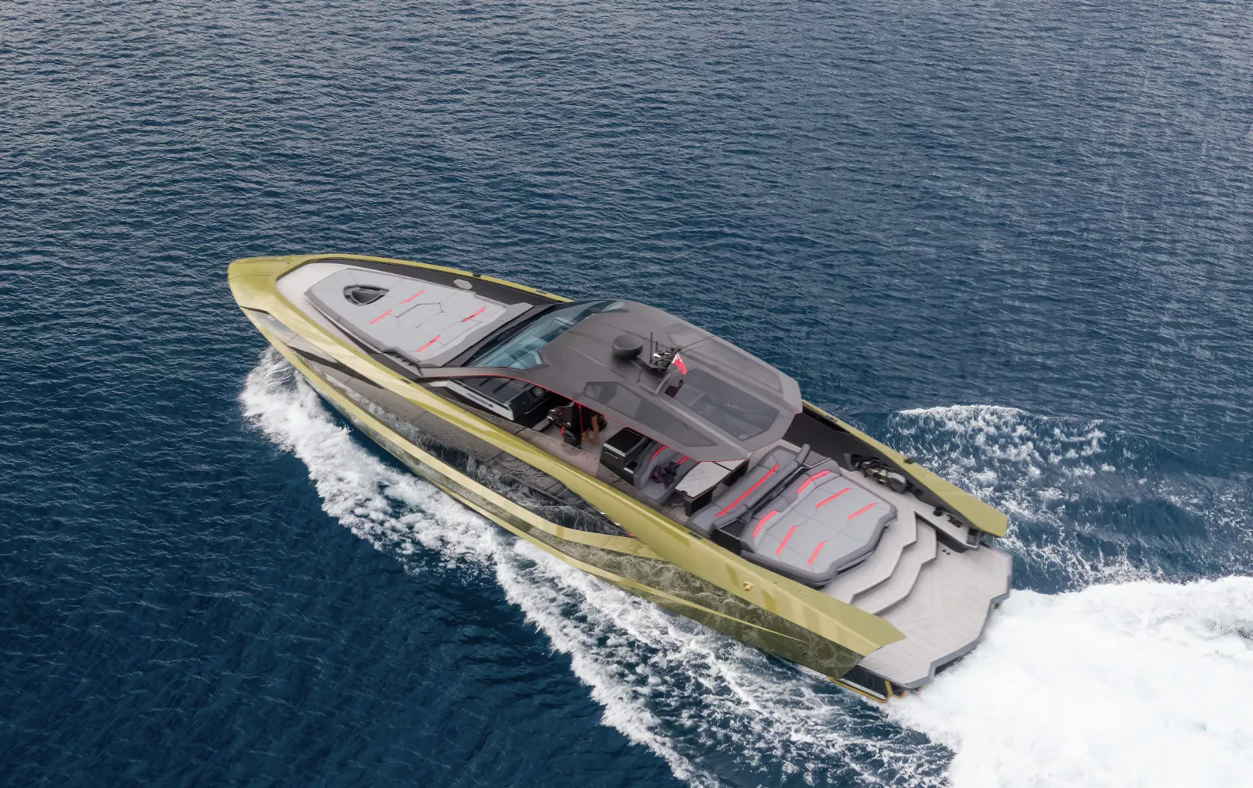 Aerial view of sleek green Lamborghini 63 yacht speeding on blue sea, white wake trailing behind.