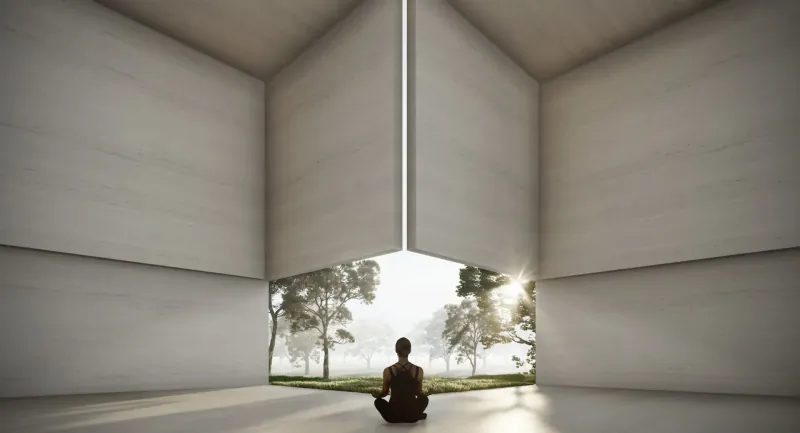 Person sits cross-legged in meditation in minimalist white room with open walls framing sunset trees outside.