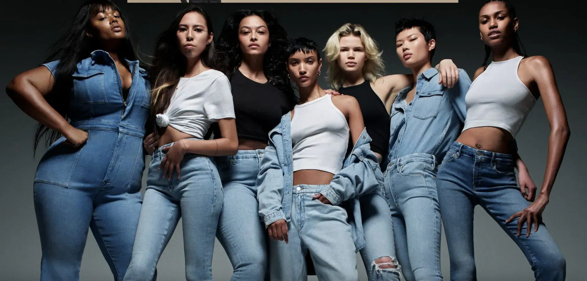 Six diverse women posing confidently in butt-lifting jeans and denim outfits on gray background