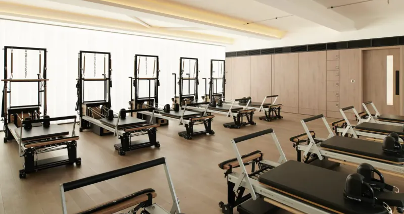 Modern Nobu Hotel Pilates studio with multiple reformers in elegant room