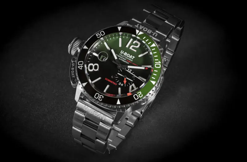 U-Boat Sommerso 46mm dive watch with green bezel, black dial, steel bracelet on dark background