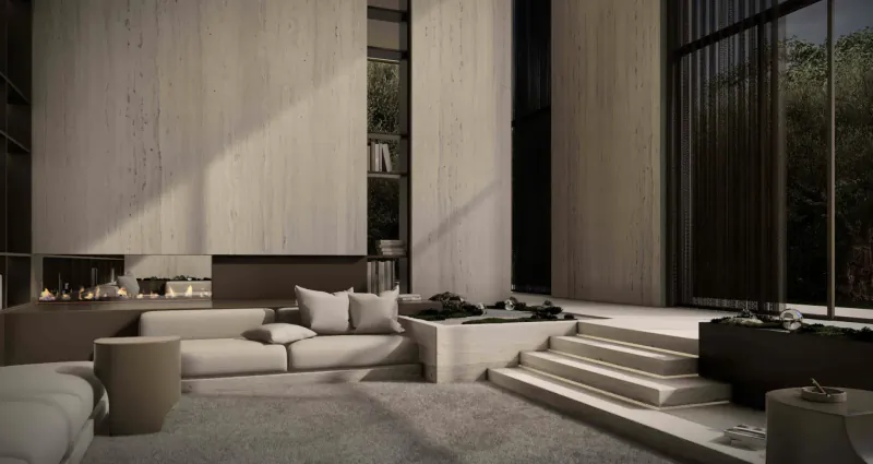 Modern minimalist living room with white L-shaped sofa, beige stone walls, linear fireplace, and garden view.