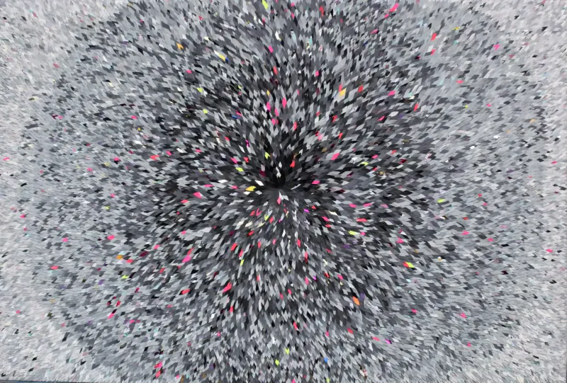 Abstract radial burst of multicolored speckles on gray background, Robi Walters art at Aston Martin Residences gallery
