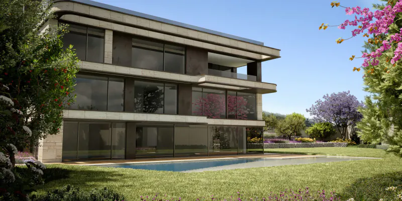 Modern three-story ultra-luxury villa in Barcelona with large windows, pool, lawn, and blooming trees under blue sky