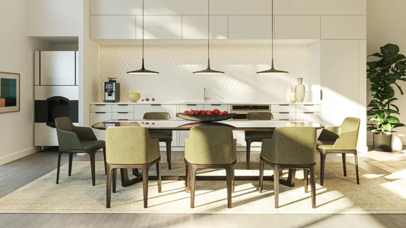 Modern dining room in Ariva Serviced Residences with white cabinets, green chairs, round table with apples, pendant lights.