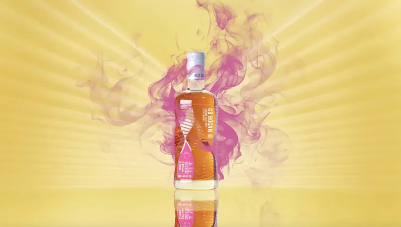 Luxury whisky bottle with pink smoke swirls on radiant yellow background, luxury Christmas gift.