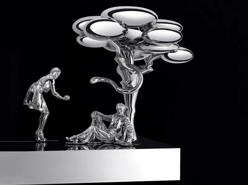Silver Jardin d’Éden sculpture: standing woman gesturing to seated man by bubble tree on base