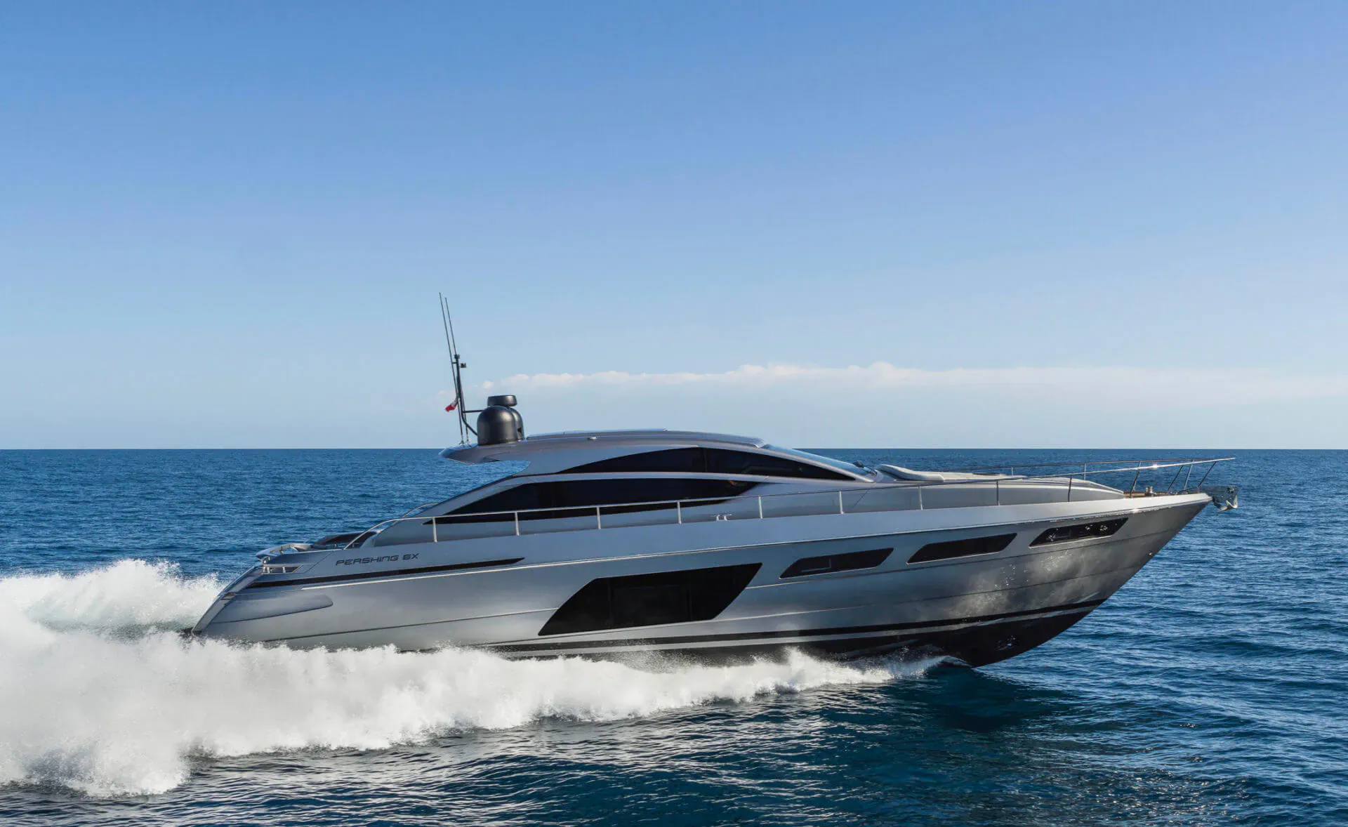 Silver Ferretti luxury yacht speeding across the ocean at Fort Lauderdale Boat Show