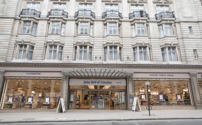 John Lewis & Partners department store facade in Marylebone Village, London, with ornate balconies and window displays.