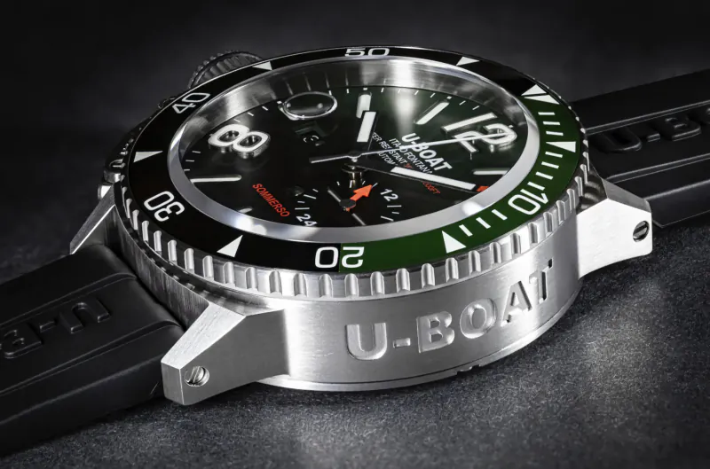U-Boat Sommerso 46mm black dive watch with green bezel, rubber strap, and U-Boat branding on angled studio view