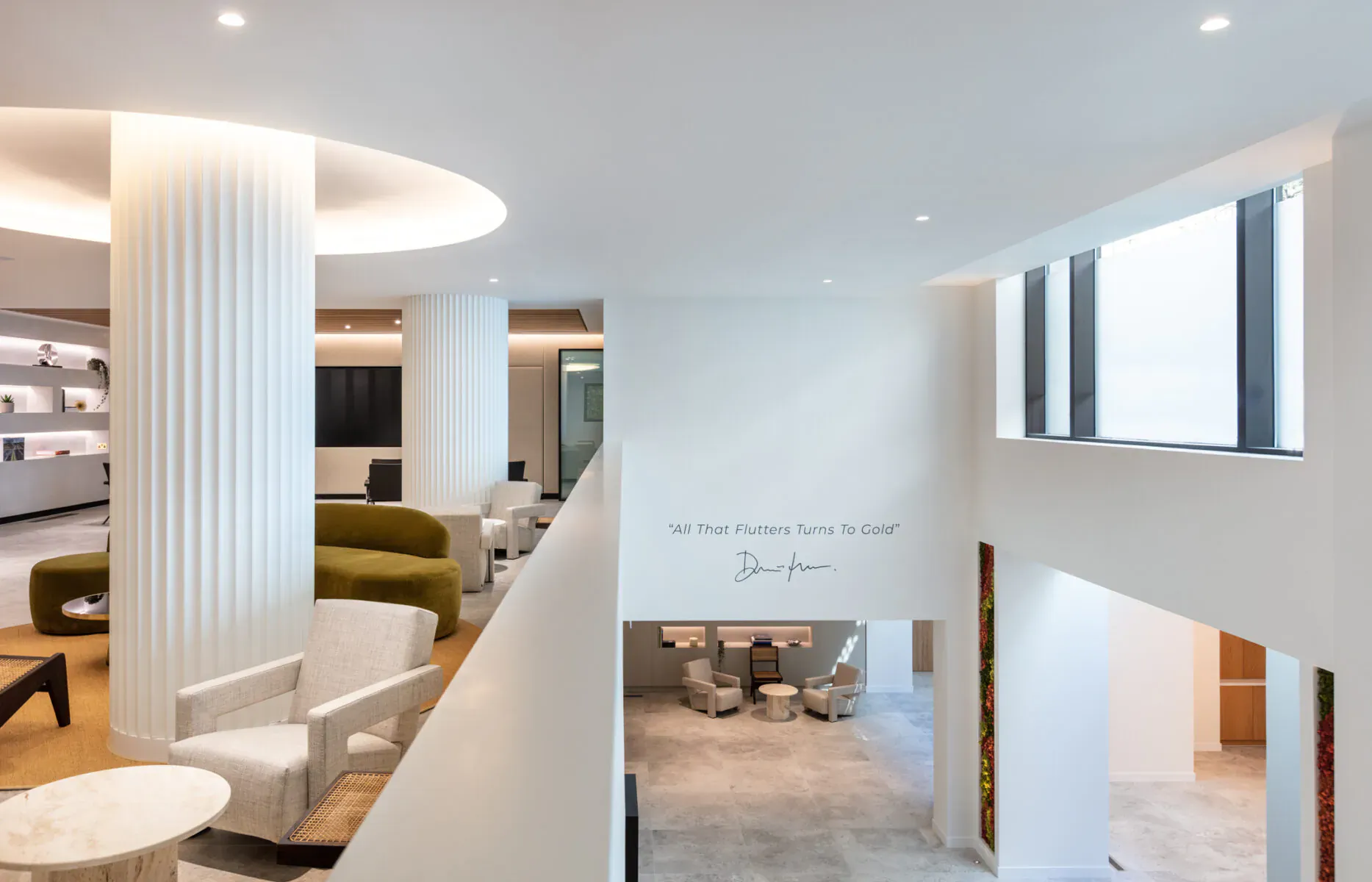 Modern Ouryonx lobby with white columns, green and white seating, large windows, and 'NeoGen Plasma' wall text