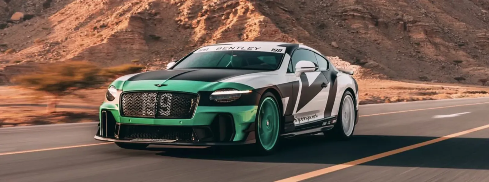 Bentley Supersports '199' coupe in green-white livery speeds on Dubai desert road for FULL SEND premiere.