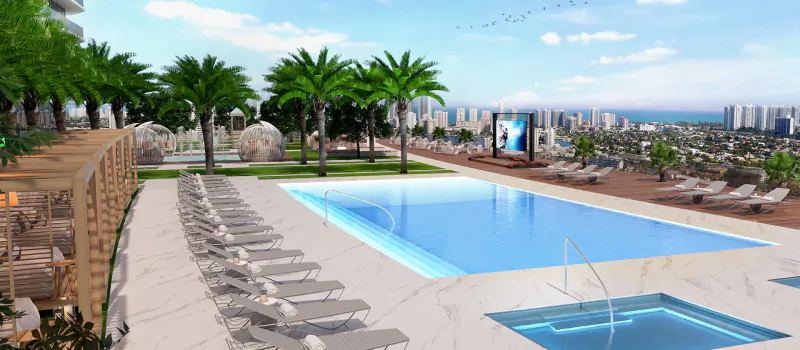 Luxury rooftop pool at Oasis Hallandale with loungers, palms, spa, screen, ocean and city skyline views.