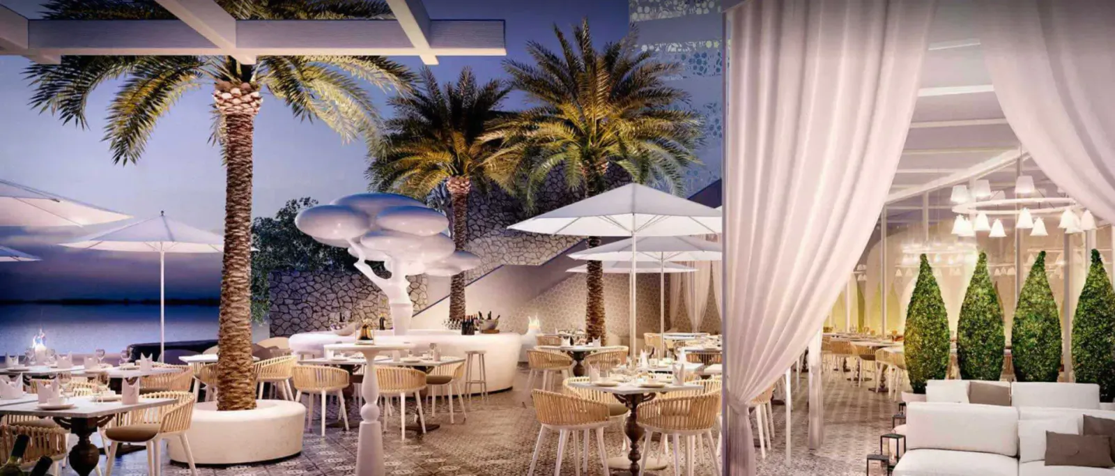 Grand Hotel Portals Nous: Elegant outdoor dining terrace with palm trees, umbrellas, and sheer drapes at sunset by the sea.
