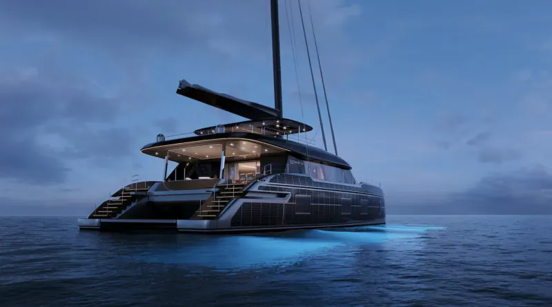 Sleek black Sunreef 100 ECO catamaran at dusk on sea, glowing blue underwater lights, stern view with open decks.