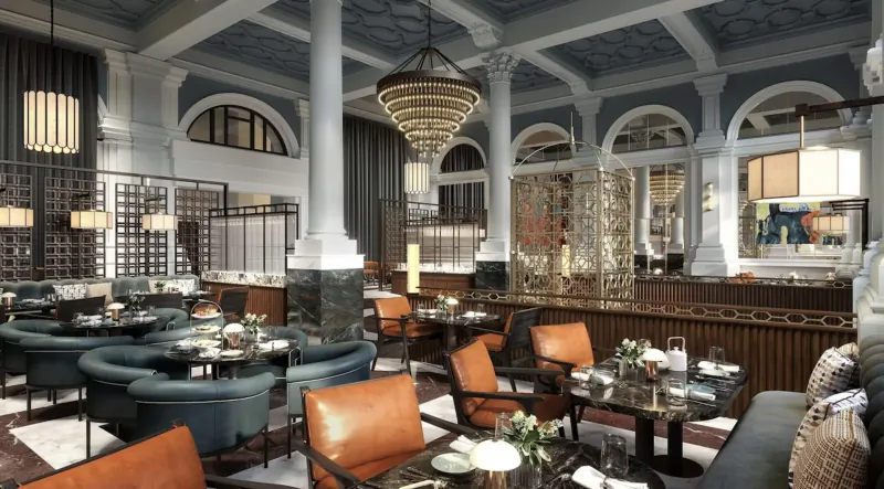 Elegant Parkgate Hotel Gallery dining room with teal and orange chairs, ornate chandelier, columns, and screens.