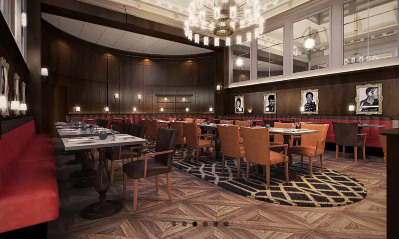 Elegant Courthouse Shoreditch dining room with red booths, wood tables, orange chairs, chandeliers, and black-and-white portraits.
