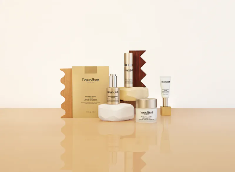 Natura Bissé skincare products for menopause: serums, creams, soap on table with 'Natura Bissé' branding.