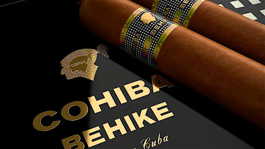 Two Cohiba Behike cigars on a black collector's case with gold logo and text