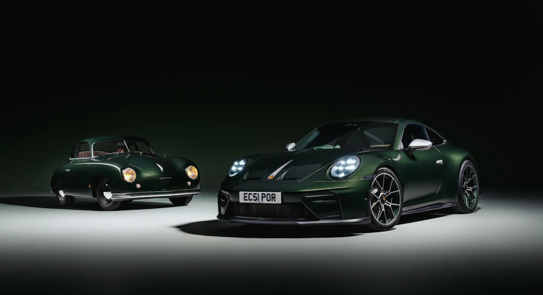 Two dark green Porsche sports cars side by side: vintage Porsche on left and modern Porsche 911 GT3 with license plate EC61 POR on right