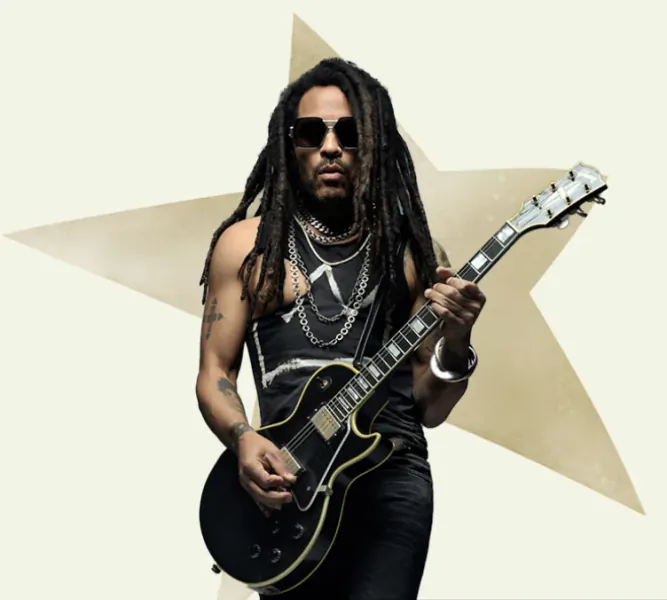 Man with dreadlocks and sunglasses holding a black electric guitar in front of a large star